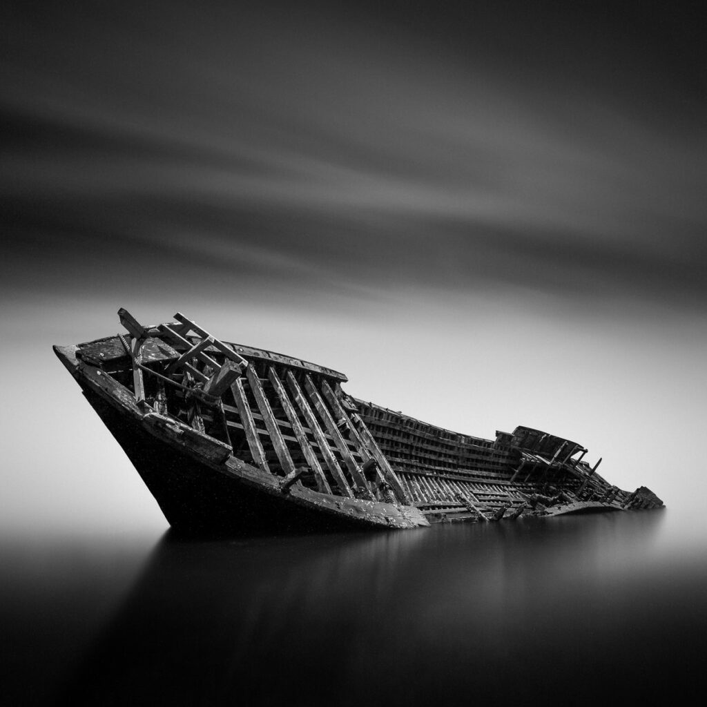 grayscale photo of a ship sinking dream