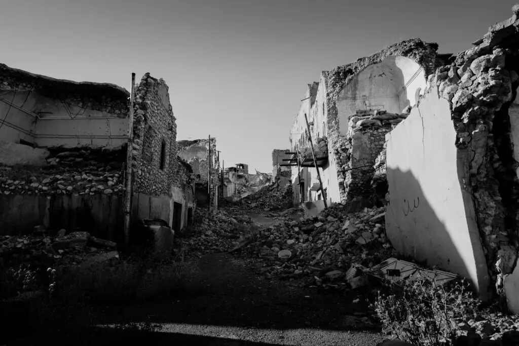 grayscale photo of concrete houses terrorism dream