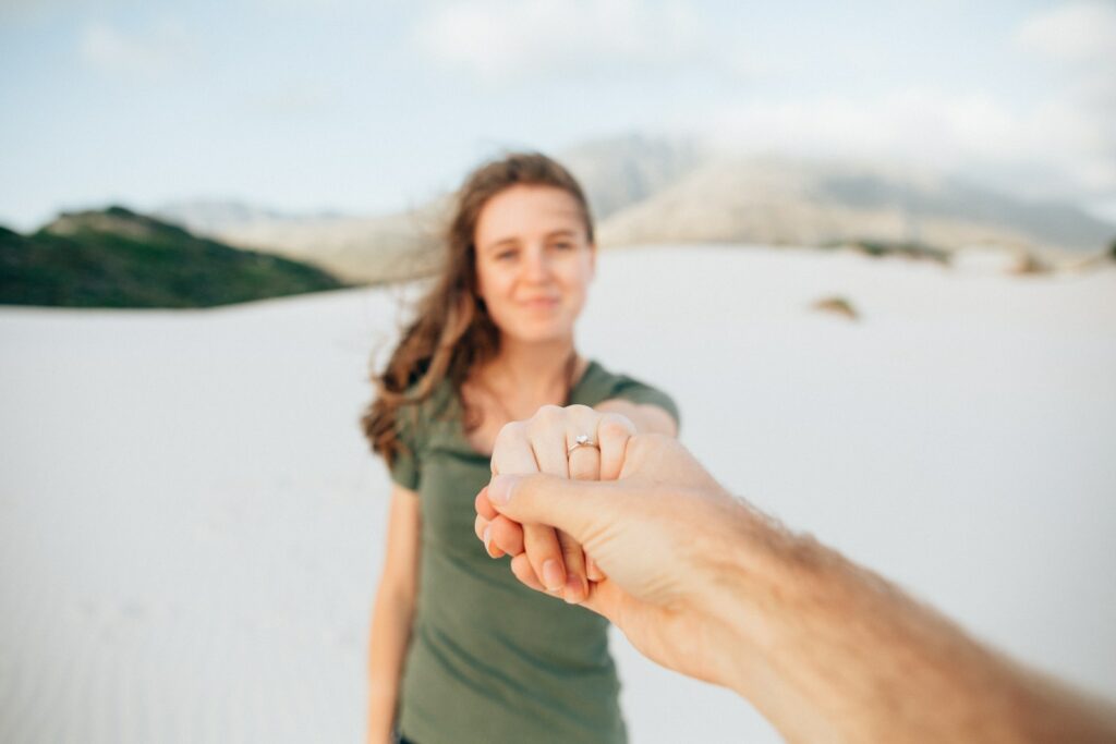 woman wearing green top holding hand hold hand dream